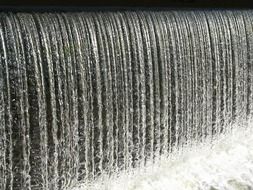 Beautiful cascade of sluice waterfall