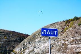 road sign on a background of rocks landscape