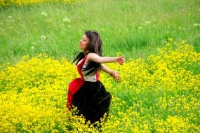 beautiful girl among the yellow field