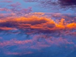 bright multi-colored cloudy sky at sunset