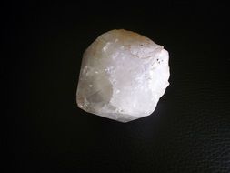 white stone on a black background