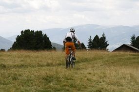 man cycling in a mountainous area