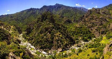 white stones on dry river bed in mountain valley, france, corsica