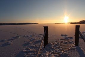 beautiful frozen winter lake at sunrise