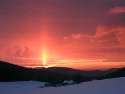 pink sunset over snowy mountains