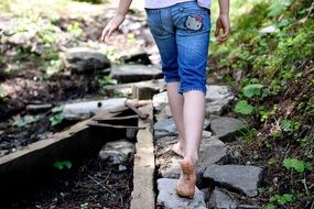 barefoot walk along the path in the forest