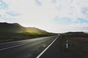 highway among hills in the countryside