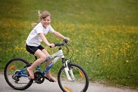Little girl on a bicycle