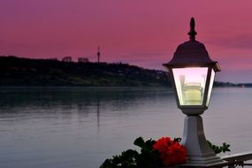 light on pier, night sea view