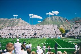 audience in the stadium watching the championship in American football