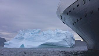 landscape of iceberg near a ship