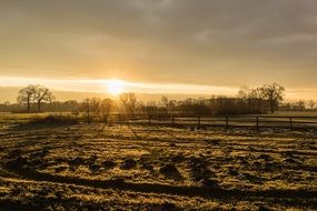 sunrise over a rural field