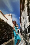 beauty woman in blue dress city landscape