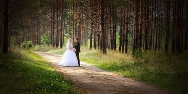 just married pair on forest road