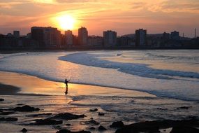 Panorama of the evening beach in Gijon, Spain