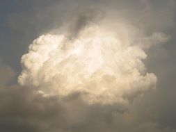 sun lights through cumulonimbus raincloud