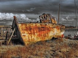 abandoned old ship on shore