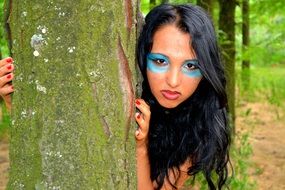 long haired girl warrior portrait near tree