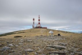 repeater base on hill cloud sky view