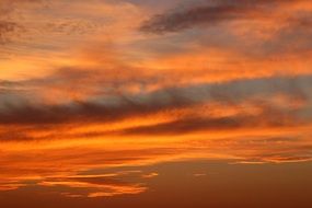 yellow clouds in the sky during sunset