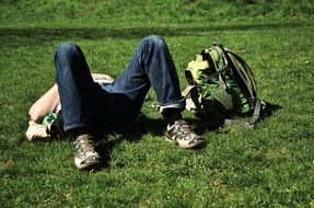 traveler is resting on the lawn
