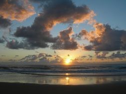 sun at sunset near the clouds