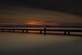 lake pier after sunset