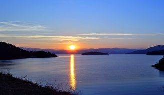 sunset on the horizon of the reservoir