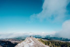 Rocky snow-capped peaks against the blue sky