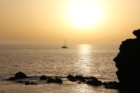 landscape of Boat on a silver Mediterranean sea