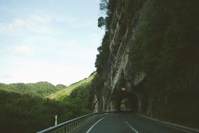 small tunnel through the mountains on the road
