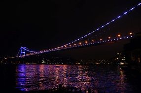 illuminated bridge at night in Istanbul