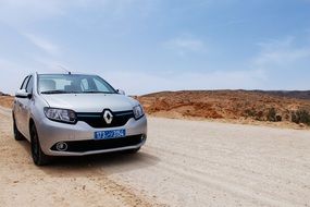 renault auto on a path in sahara