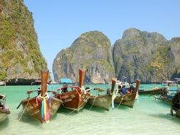 boats on a rocky landscape at Koh Phi Phi, Thailand