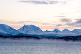 mountains in the snow near the lake