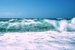 ocean waves splashing on shore