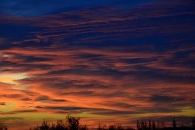 orange clouds in the sky during sunrise