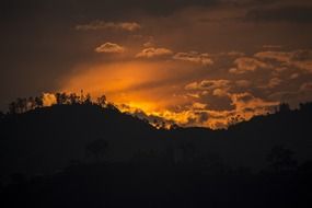 sun behind mountains