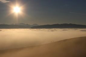 mountains in a sea of fog