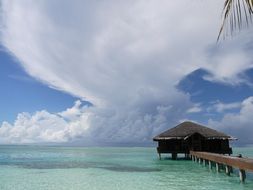 tranquil view of a small house in the ocean