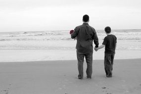Dad and son on a beach