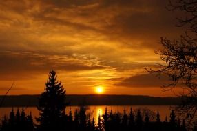 landscape of orange sun and clouds on sky