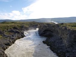 foamy stream in scenic landscape, iceland