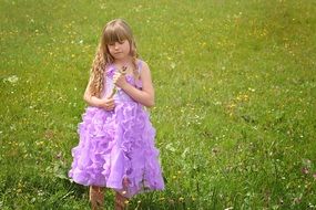girl in purple dress outside