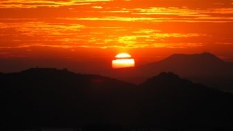 orange sunset in the mountains