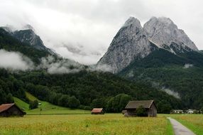 village on green hill mountains alps