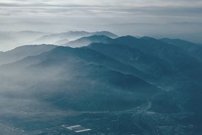 Valleys and hills in the clouds