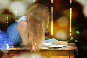 reading girl with blond hair