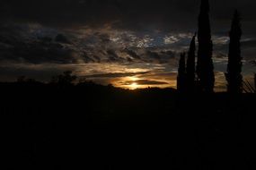 sunset sun on the horizon in the dark