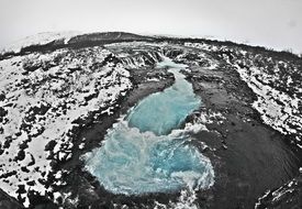 iceland winter waterfall landscape